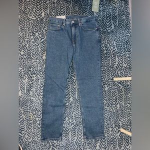 Men’s straight blue jeans medium wash.